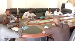 Steering committee meeting around a table, as part of the Community-Led Climate Adaptation