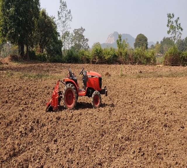 Field and tractor in Keonjhar, India