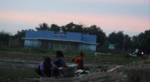 Women washing clothes in a river India