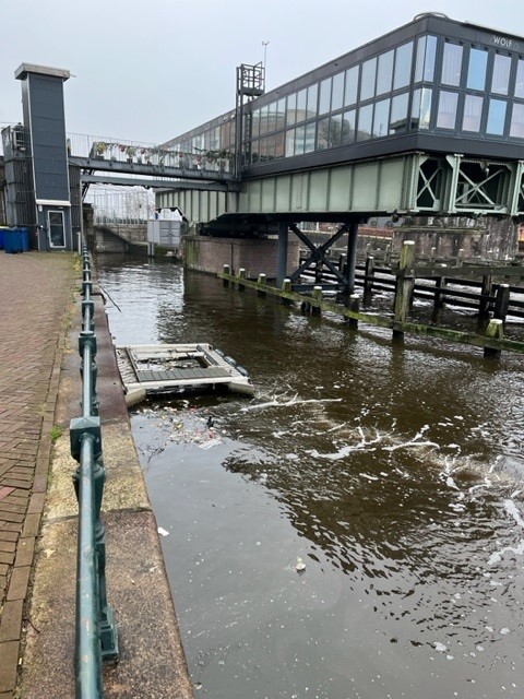 Plastic dirt collected in receptor, bubble barrier for water quality in Amsterdam